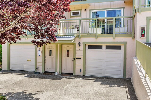 3 Aries Ln, Novato, CA 94947 - townhome / multi-family property with a balcony, driveway, and a garage