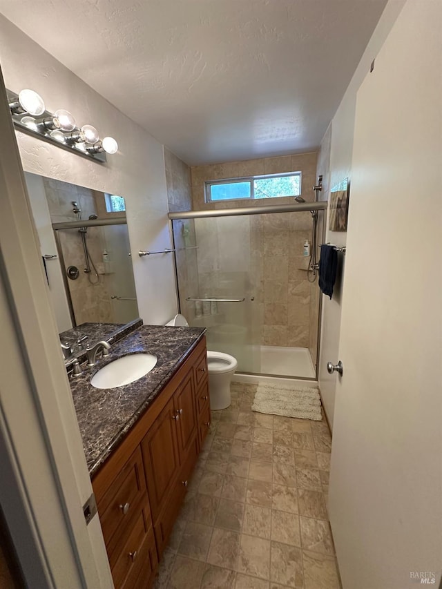 3 Aries Ln, Novato, CA 94947 - bathroom with a shower stall, vanity, toilet, and stone finish floors