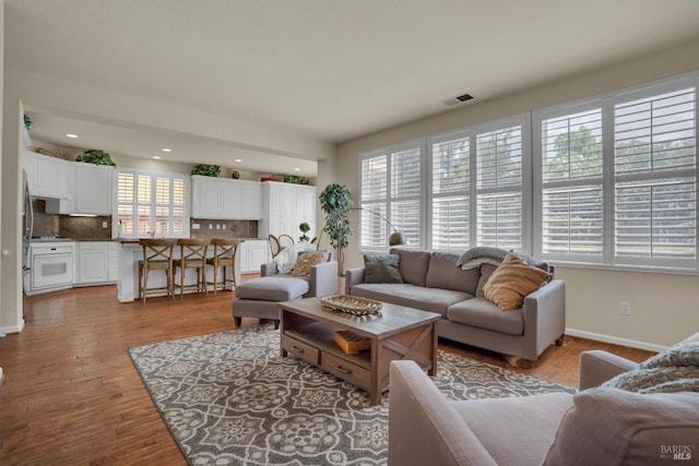 116 Birmingham Ct, Discovery Bay, CA 94505 - living room featuring baseboards, light wood-style floors, and recessed lighting