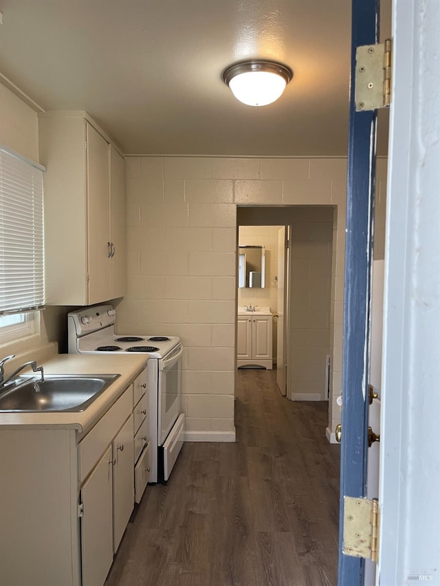 560 Talmage Rd, Ukiah, CA 95482 - kitchen featuring electric stove, a sink, light countertops, dark wood-type flooring, and white cabinetry