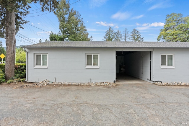560 Talmage Rd, Ukiah, CA 95482 - view of side of home with concrete block siding and roof with shingles