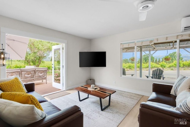 725 Lytton Station Rd, Healdsburg, CA 95448 - living area featuring baseboards, an AC wall unit, and wood finished floors
