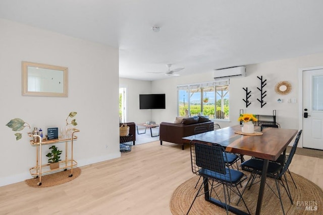 725 Lytton Station Rd, Healdsburg, CA 95448 - dining space featuring a wall mounted AC, light wood-style flooring, and ceiling fan