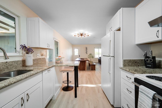 725 Lytton Station Rd, Healdsburg, CA 95448 - kitchen with light wood-style floors, white cabinets, white appliances, and a sink