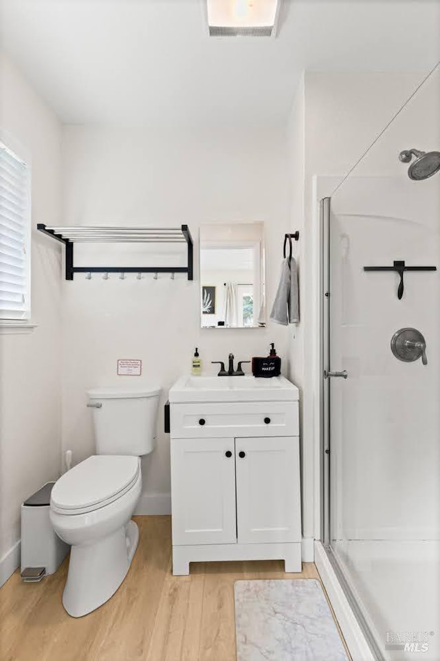 725 Lytton Station Rd, Healdsburg, CA 95448 - full bathroom featuring a stall shower, wood finished floors, toilet, and plenty of natural light