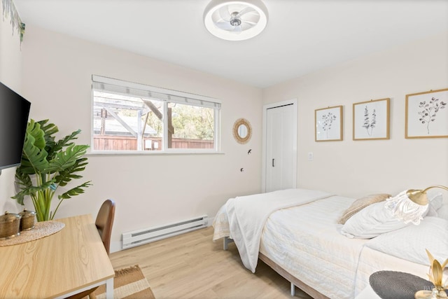 725 Lytton Station Rd, Healdsburg, CA 95448 - bedroom with baseboard heating and light wood-style floors