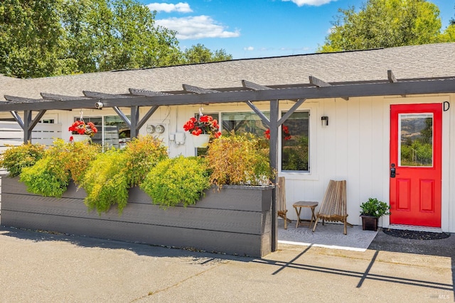 725 Lytton Station Rd, Healdsburg, CA 95448 - view of exterior entry featuring a pergola and a shingled roof