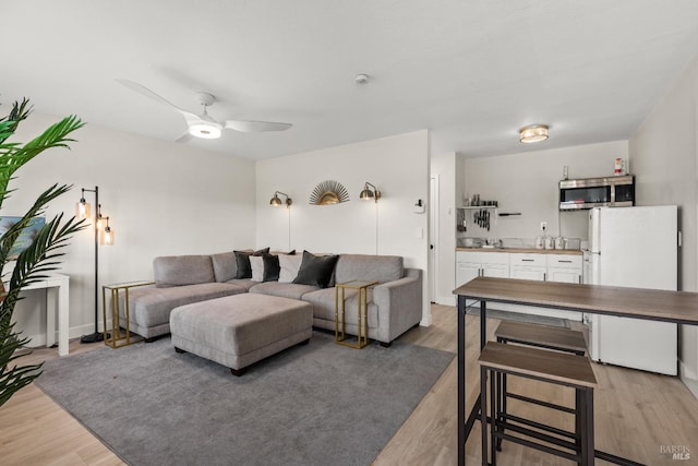 725 Lytton Station Rd, Healdsburg, CA 95448 - living area with light wood-style floors and ceiling fan