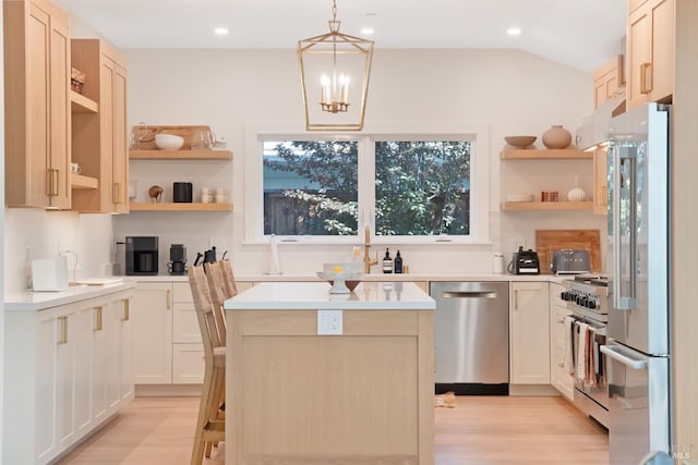 20 Almenar Dr, Greenbrae, CA 94904 - kitchen featuring premium appliances, open shelves, light wood-type flooring, a center island, and light countertops