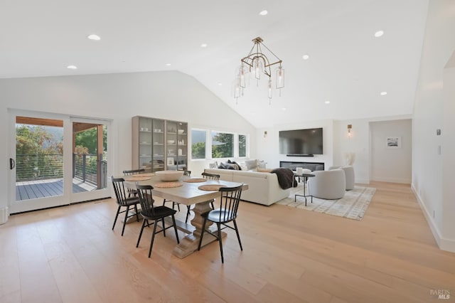 20 Almenar Dr, Greenbrae, CA 94904 - dining room with high vaulted ceiling, plenty of natural light, light wood-type flooring, and a chandelier