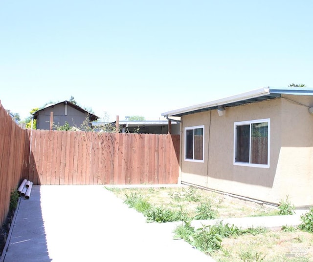 1863 Mini Dr, Vallejo, CA 94589 - view of property exterior featuring stucco siding and a patio
