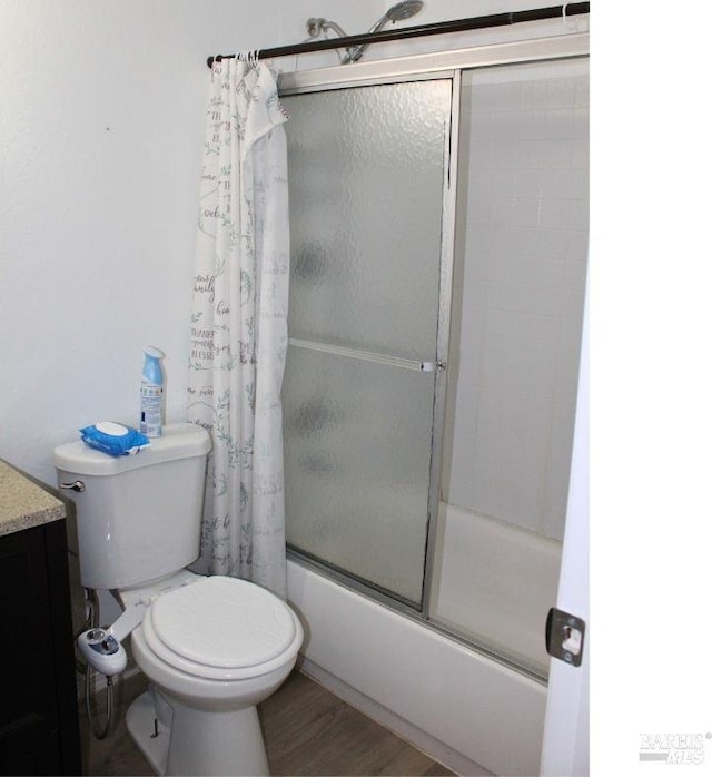 1863 Mini Dr, Vallejo, CA 94589 - full bath featuring toilet, shower / bath combination with glass door, vanity, and wood finished floors