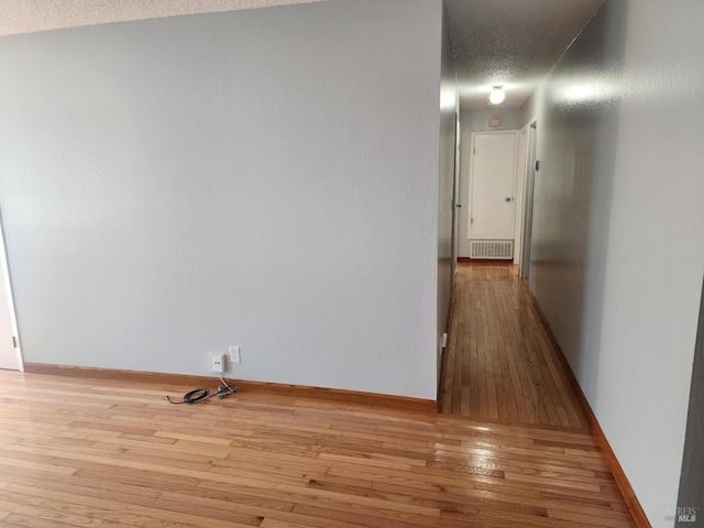 1863 Mini Dr, Vallejo, CA 94589 - corridor featuring hardwood / wood-style flooring, a textured ceiling, and baseboards