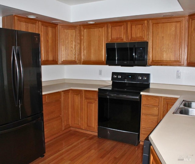1863 Mini Dr, Vallejo, CA 94589 - kitchen with black appliances and brown cabinets