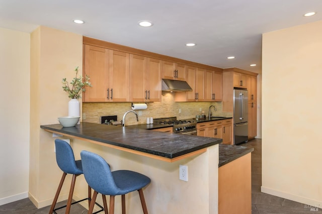 1721 Northstar Dr, Petaluma, CA 94954 - kitchen with stainless steel appliances, under cabinet range hood, tasteful backsplash, baseboards, and recessed lighting