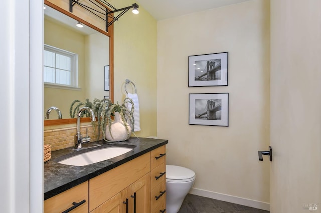 1721 Northstar Dr, Petaluma, CA 94954 - bathroom with vanity, tasteful backsplash, toilet, and baseboards