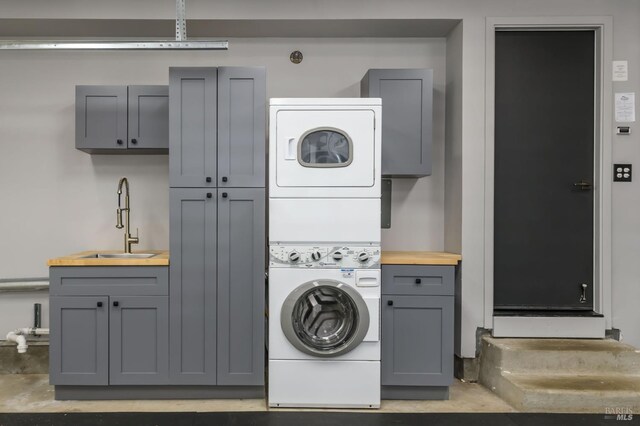 1721 Northstar Dr, Petaluma, CA 94954 - washroom with stacked washer / dryer and cabinet space
