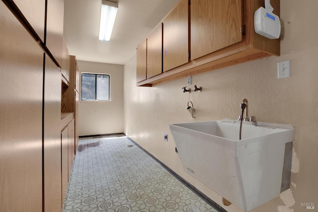 4009 Rimrock Dr, Antioch, CA 94509 - laundry area featuring cabinet space, hookup for a washing machine, and baseboards