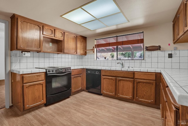 4009 Rimrock Dr, Antioch, CA 94509 - kitchen featuring black appliances, tasteful backsplash, and brown cabinets