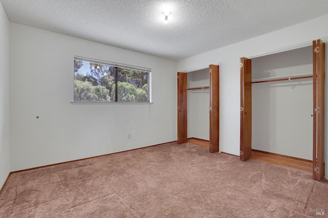 4009 Rimrock Dr, Antioch, CA 94509 - unfurnished bedroom with multiple closets, a textured ceiling, carpet floors, and baseboards