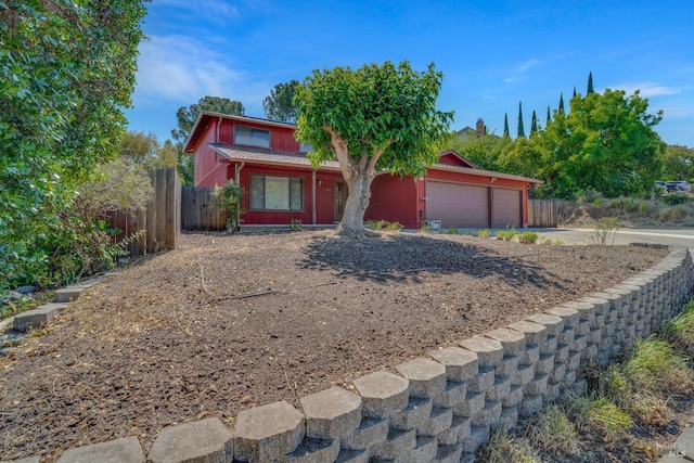 4009 Rimrock Dr, Antioch, CA 94509 - view of property hidden behind natural elements featuring a garage and concrete driveway