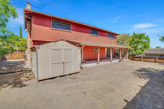 4009 Rimrock Dr, Antioch, CA 94509 - rear view of property featuring a fenced backyard, a chimney, and a patio