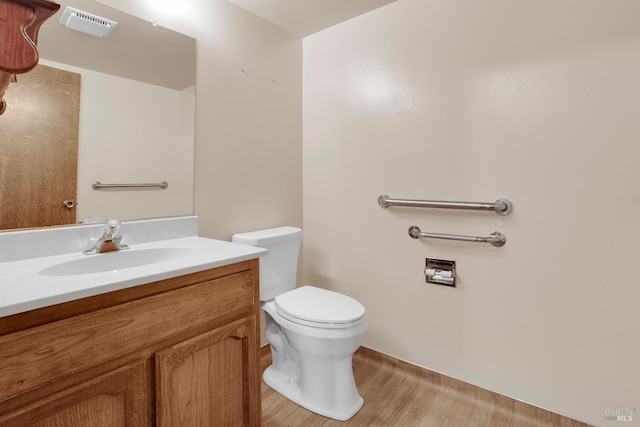4009 Rimrock Dr, Antioch, CA 94509 - bathroom with toilet, vanity, and wood finished floors