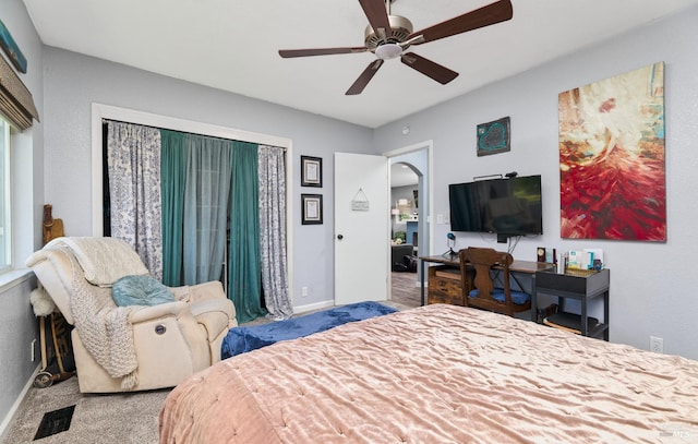 46 N 4th St, Rio Vista, CA 94571 - bedroom with carpet floors, arched walkways, ceiling fan, and baseboards