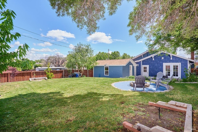 46 N 4th St, Rio Vista, CA 94571 - view of yard featuring french doors, a patio, a vegetable garden, and an outdoor fire pit