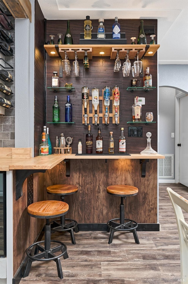46 N 4th St, Rio Vista, CA 94571 - indoor dry bar with wood finished floors and arched walkways