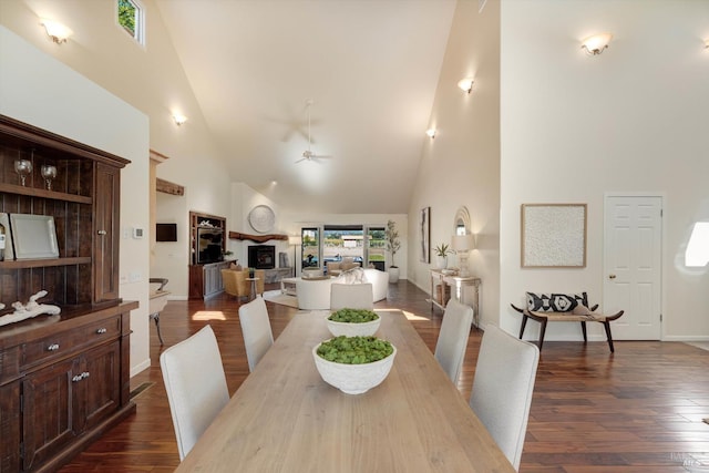 466 Pratt Ave, Saint Helena, CA 94574 - dining space featuring high vaulted ceiling, a ceiling fan, dark wood-type flooring, baseboards, and a fireplace