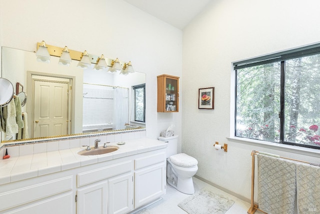 22111 Umland Cir, Jenner, CA 95450 - full bathroom with toilet, vanity, curtained shower, baseboards, and high vaulted ceiling