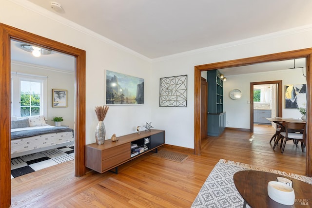 439 4th St E, Sonoma, CA 95476 - living area with light wood-style floors, ornamental molding, healthy amount of natural light, and baseboards