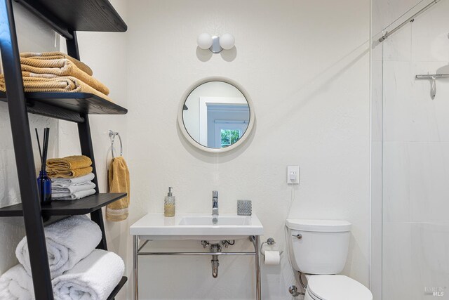 439 4th St E, Sonoma, CA 95476 - bathroom featuring toilet, a sink, and a shower