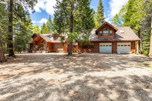 9547 Grassland Ct, Shingletown, CA 96088 - log home featuring a garage, driveway, and log exterior