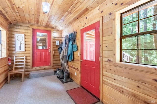 9547 Grassland Ct, Shingletown, CA 96088 - entryway featuring vaulted ceiling, rustic walls, carpet flooring, and wood ceiling
