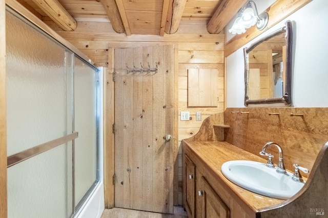 9547 Grassland Ct, Shingletown, CA 96088 - full bath with vanity, wooden ceiling with exposed beams, wooden walls, and combined bath / shower with glass door