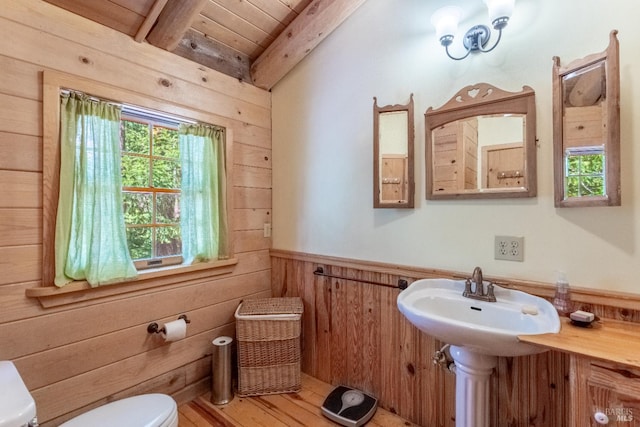 9547 Grassland Ct, Shingletown, CA 96088 - bathroom with toilet, wooden walls, wooden ceiling with exposed beams, and a wainscoted wall