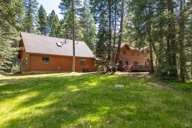 9547 Grassland Ct, Shingletown, CA 96088 - rear view of property with a deck, a lawn, and a shingled roof