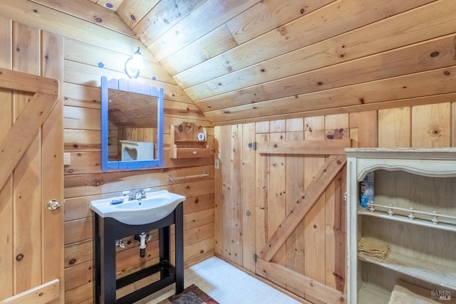 9547 Grassland Ct, Shingletown, CA 96088 - bathroom with vaulted ceiling, wood walls, wooden ceiling, tile patterned floors, and a sink
