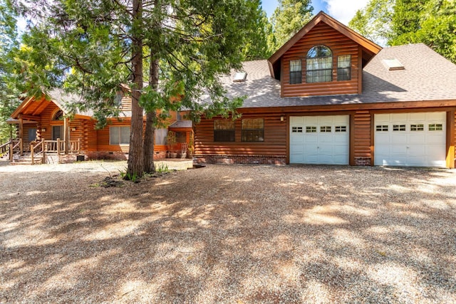 9547 Grassland Ct, Shingletown, CA 96088 - cabin featuring gravel driveway, roof with shingles, and a garage