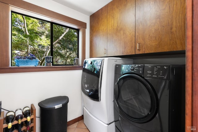 7 Linsdale Ln, Point Reyes Station, CA 94956 - washroom with cabinet space, washing machine and dryer, light tile patterned flooring, and baseboards