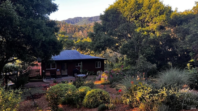 168 Vision Rd, Inverness, CA 94937 - back of property with covered porch, a mountain view, and a forest view