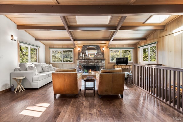 168 Vision Rd, Inverness, CA 94937 - living room with dark wood finished floors, plenty of natural light, a fireplace, wooden ceiling with exposed beams, and wooden walls