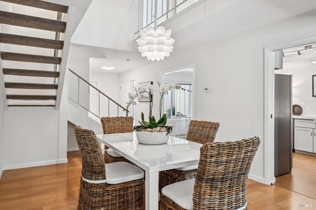9 California Condor Way, Novato, CA 94949 - dining space featuring stairway, light wood-style floors, and baseboards