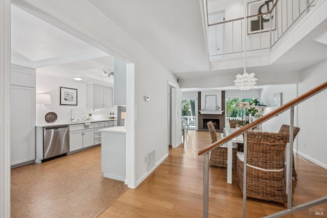 9 California Condor Way, Novato, CA 94949 - entrance foyer featuring baseboards, a brick fireplace, and light wood-style floors