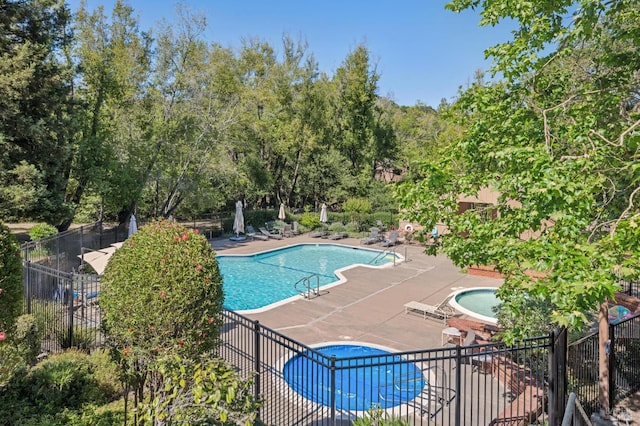 9 California Condor Way, Novato, CA 94949 - community pool with a hot tub, a patio area, and view of wooded area