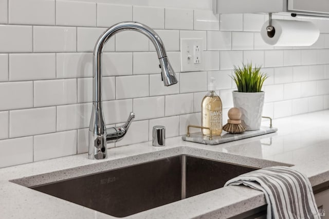 9 California Condor Way, Novato, CA 94949 - kitchen view of a sink, backsplash, and light stone countertops