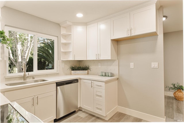 50 Montego Ct, Suisun City, CA 94585 - kitchen featuring dishwasher, light wood-style flooring, white cabinets, decorative backsplash, and open shelves