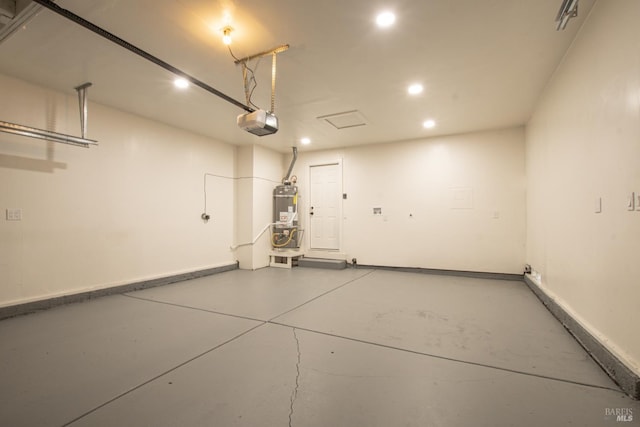 50 Montego Ct, Suisun City, CA 94585 - garage featuring a garage door opener, recessed lighting, and secured water heater